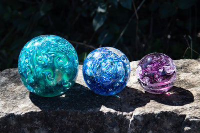 Glass orbs with cremation ash